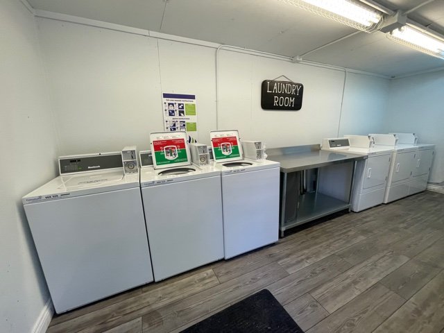 On-site laundry room with washers and dryers at Angleton RV Park & Resort